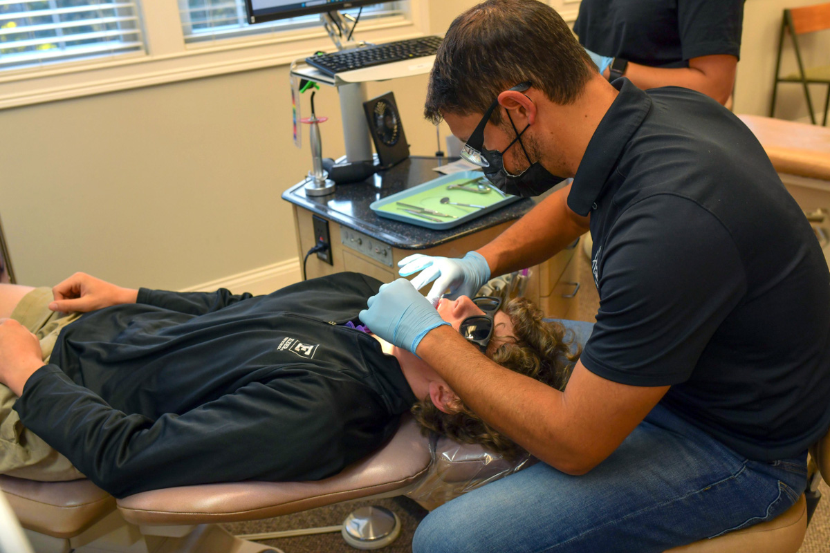 Dr working on patient