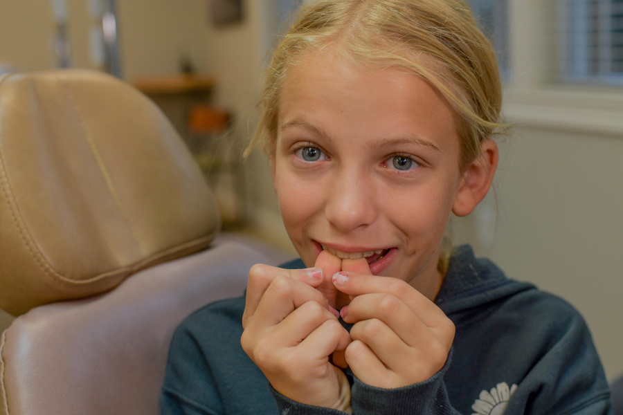 Child with her thumbs in mouth