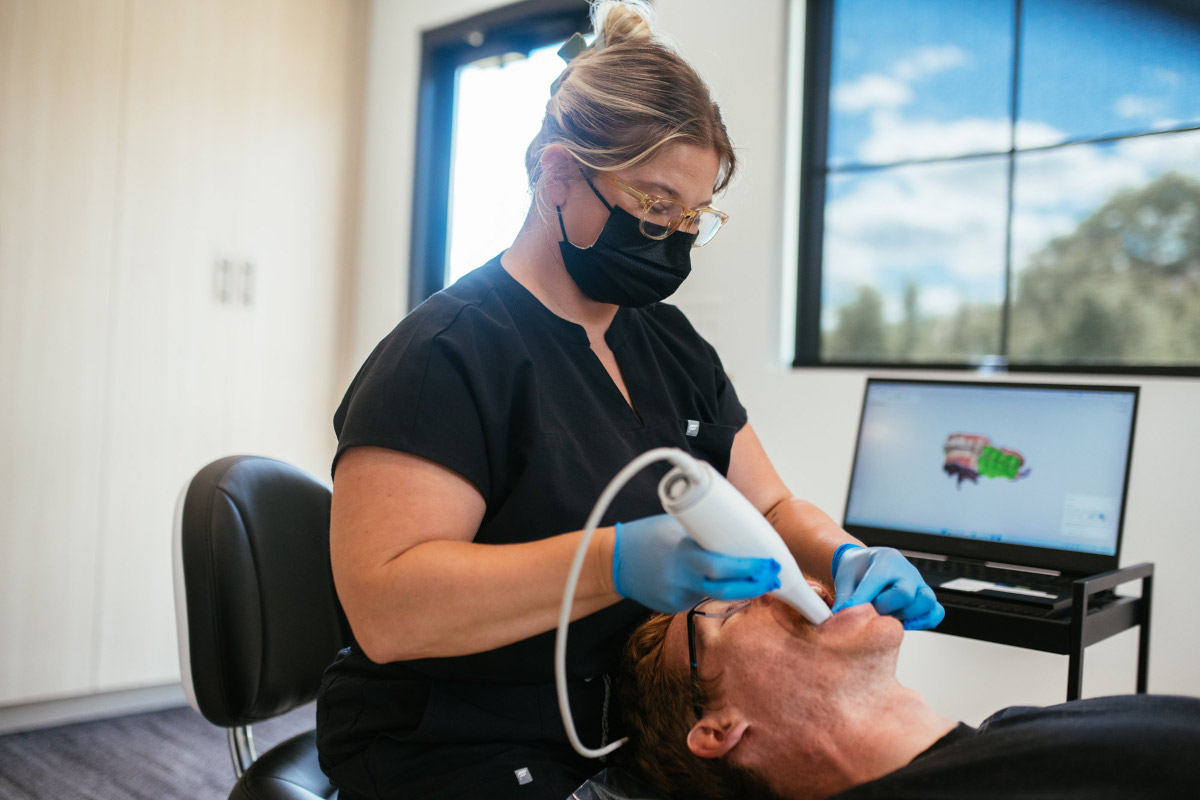 Clinical assistant taking an iTero digital scan for clear aligners at Haverkos Family Orthodontics in Harrison, OH.